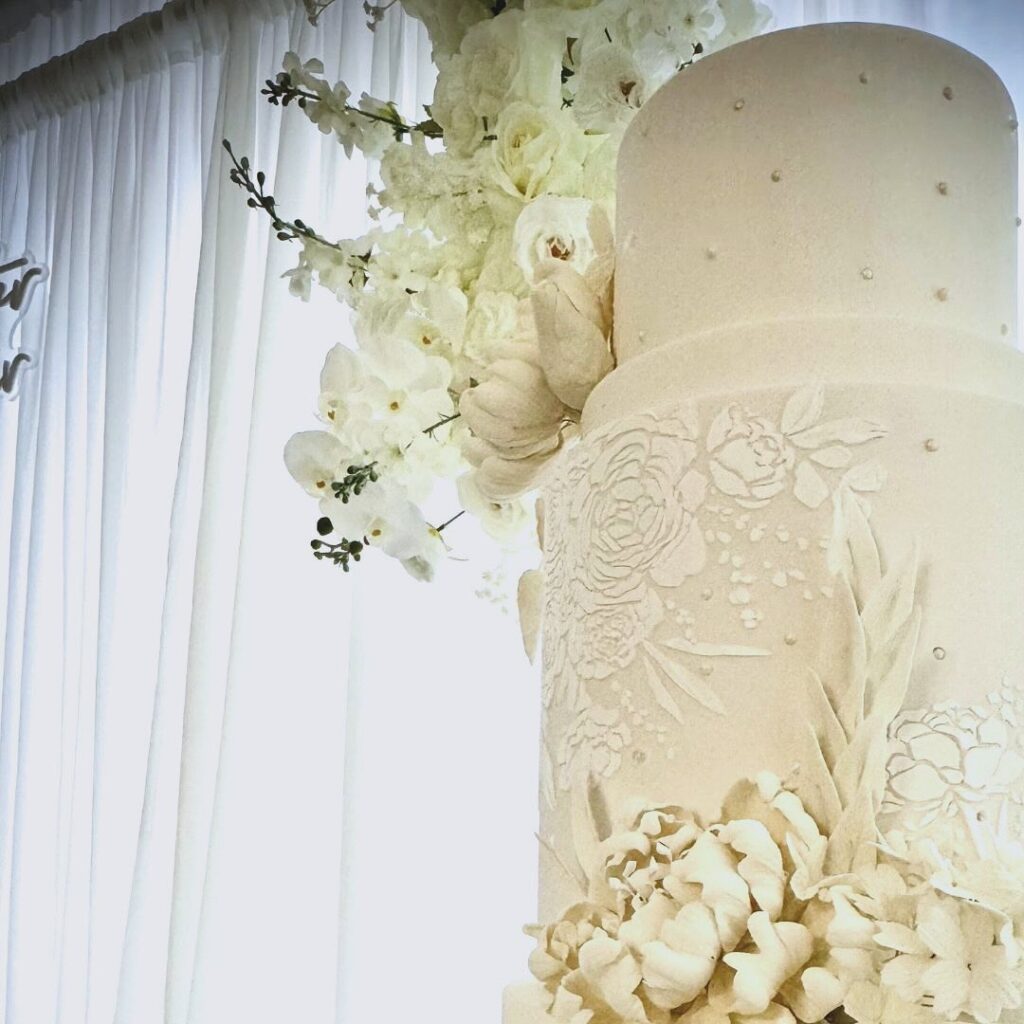 White wedding cake with white gumpaste peony